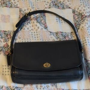 Coach Black Leather Shoulder Bag with Flap Closure and Gold Hardware